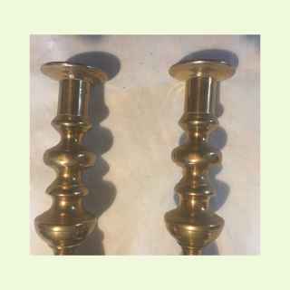 2 Antique brass candlesticks.