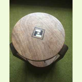 Small two-tiered circular art deco side tables with geometric parquetry decoration.