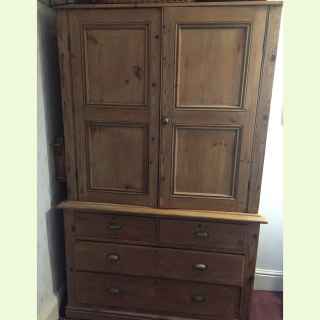 Large antique pine cupboard with drawers.